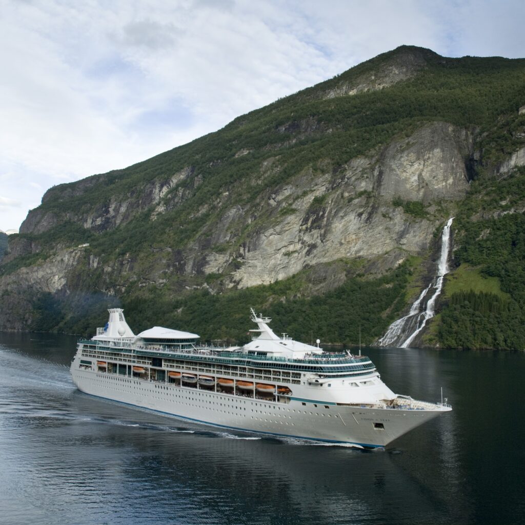 Vision of the Seas at the river with mountain in the background.