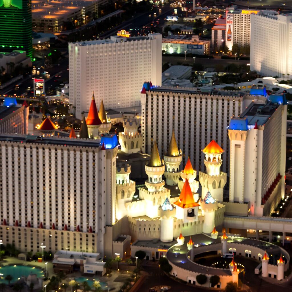 Aerial view of the Excalibur Hotel Casino Las Vegas at night.
