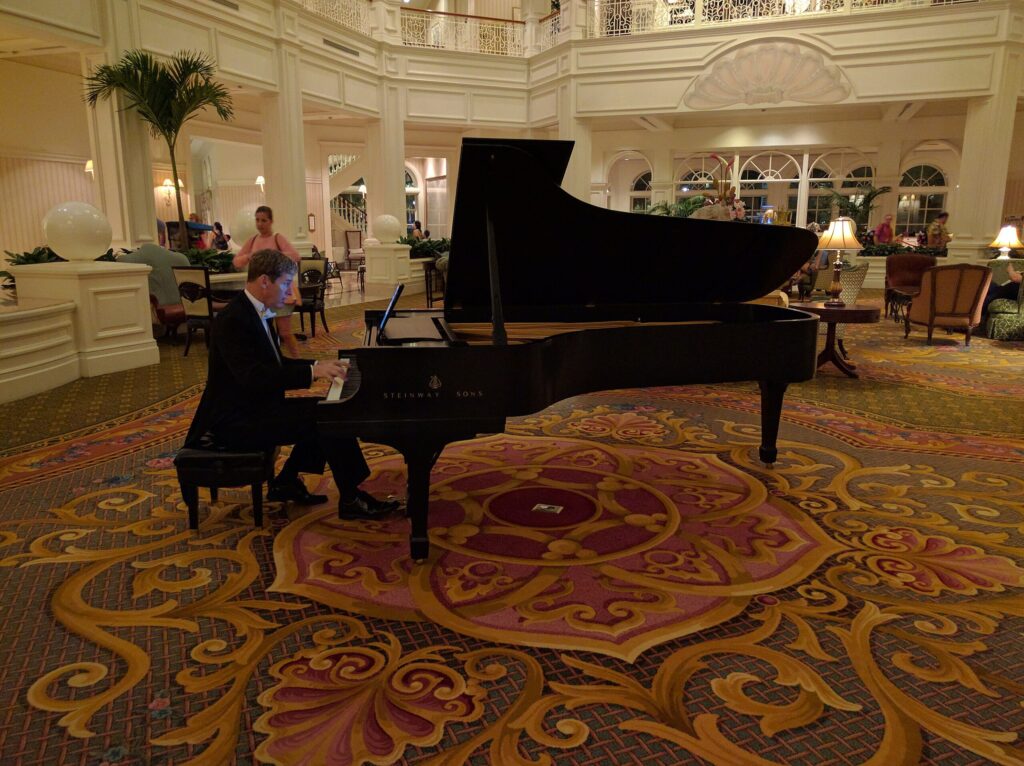 Musician playing piano at the lobby of the Grand Floridian.